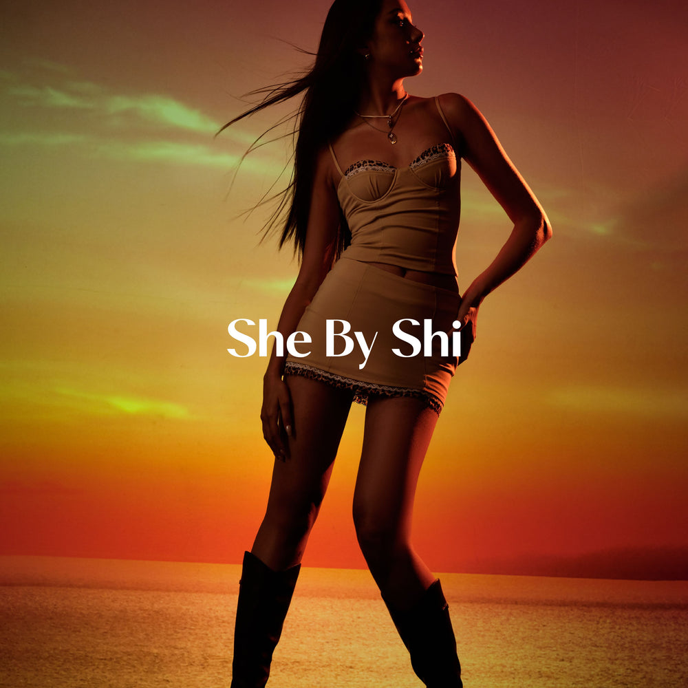 She by Shi